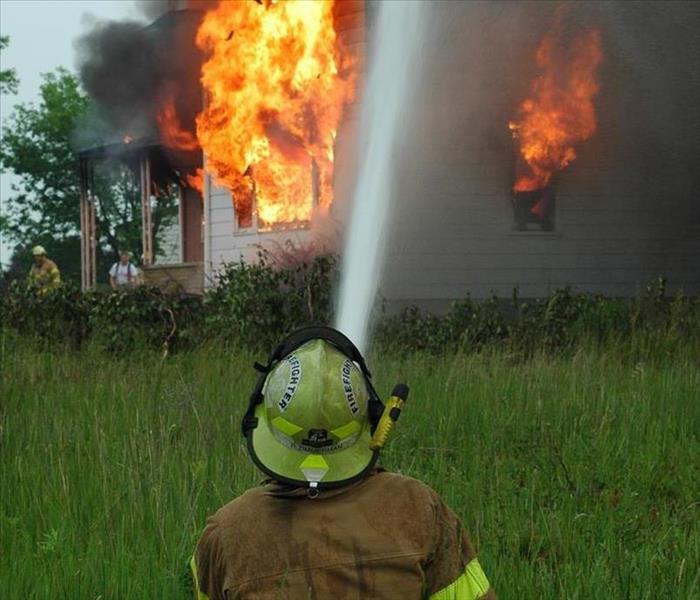 Firefighter puts out house fire