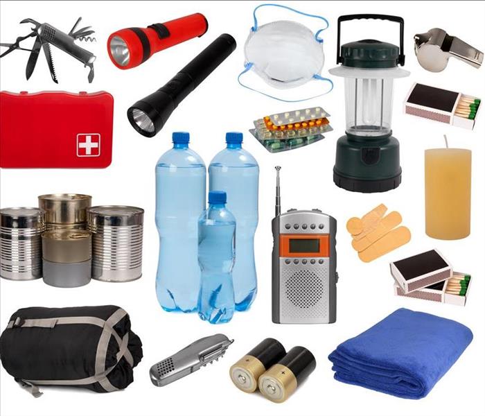 Emergency disaster supplies: water, blankets, flashlights